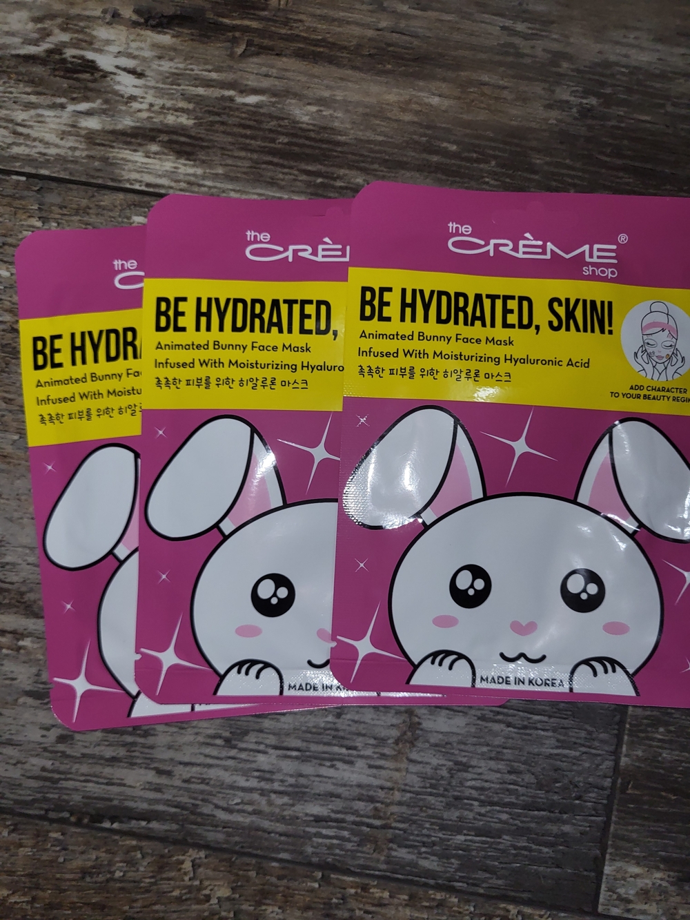 the CREME Shop Pink "Be Hydrated, Skin!" Animated Bunny Face Mask